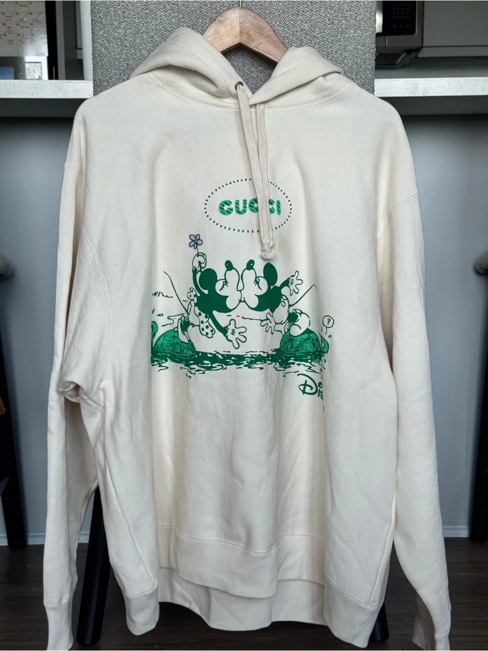 Gucci Cream Hoodie with Green Disney Graphic
